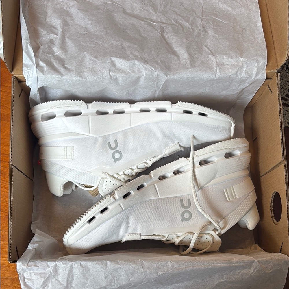 On Running Cream and White Athletic Shoes